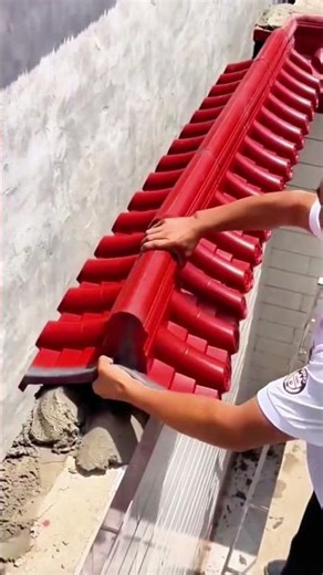 Red tile aligns with string, cement seals bond