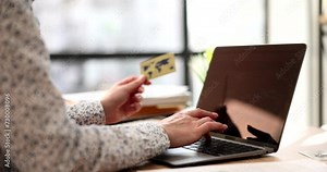 Manager is holding credit bank card and computer keyboard. Online payments and online money transfer security concept