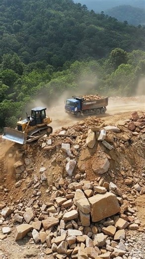 Heavy Equipment Working on Rocky Hillside Excavation