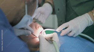 child boy in a dentist's chair treats teeth at dental doctors drill teeth treat caries