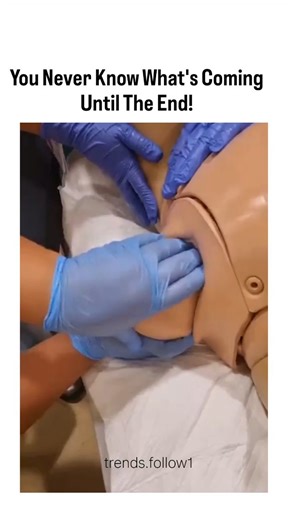 Films | Movies | Tv series on Instagram: "The post shares a 14-second video simulating a childbirth training session with a medical mannequin, depicting the intense moment of a baby doll emerging head-first amid gloved hands assisting the delivery. Uploaded by a viral media curator, it exploded to over 1 million views within hours, sparking humorous replies likening the flailing baby arms to a "high-five" or "tentacled placenta." The caption's suspenseful phrasing heightens the reveal of the rou
