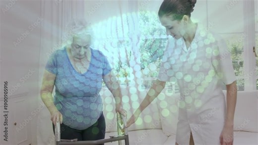 Caregiver pointing and steadying walker, senior woman taking cautious steps during mobility rehab