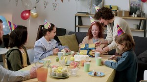 Birthday girl opening gift | Free Stock Video Footage