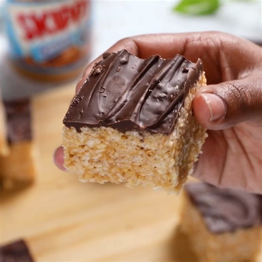 These peanut butter cereal bars are a perfect after-school snack that's a hit with everyone and easy enough to make you can get some helpers of all ages in the kitchen. https://www.peanutbutter.com/recipe/peanut-butter-cereal-bars/ | SKIPPY Peanut Butter