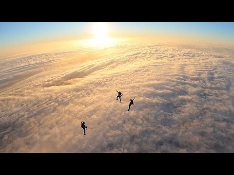 Standing Skydive Near Wall Of Clouds