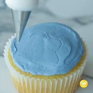 With St. Patrick's Day in the past, it's time to focus on spring bakes! 🌼🧁 Here's a pretty technique to try on your next batch of cupcakes, lace embroidery: http://bit.ly/3JkLKh9 | Wilton Cake Decorating