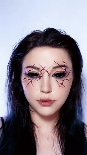 Natasha Jane Wood on Instagram: "Fake Slasher Liner 🔪 Definitely inspired by The Angry Princess on 13 Ghosts 🤭 • PRODUCTS: @mehronmakeup AQ Paints @kvdbeauty Tattoo Liner @nyxcosmetics_uk black jumbo liner @beautybaycom Bright matte palette - - - #graphicliner #creativemakeup #halloweenmakeup"