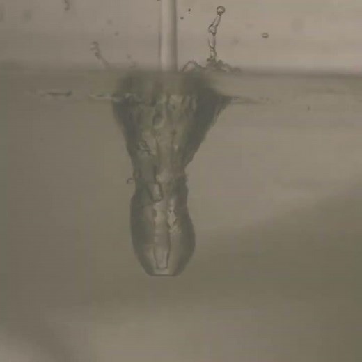 Inception of air entrainment by impingement of vertical jet