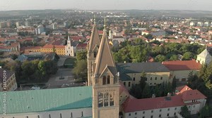 Aerial / drone footage of Pécs Cathedral in Pécs, the fifth largest city of Hungary, a major cultural center of Hungary, on the slopes of the Mecsek mountains