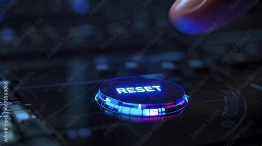 Finger pressing illuminated RESET button on a dark electronic circuit board, concept of restarting technology