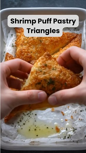 Shrimp Puff Pastry Triangles Golden, flaky, and bursting with creamy shrimp filling — these irresistible puff pastry triangles disappear the moment they hit the table. Ingredients 1 sheet puff pastry, thawed 1 lb shrimp, peeled, deveined, and finely chopped 4 oz cream cheese, softened ½ cup shredded mozzarella cheese 2 cloves garlic, minced 1 tbsp olive oil ½ tsp paprika ¼ tsp black pepper ½ tsp salt 1 tbsp fresh parsley, chopped 1 egg, beaten (for egg wash) Optional: grated Parmesan for topping