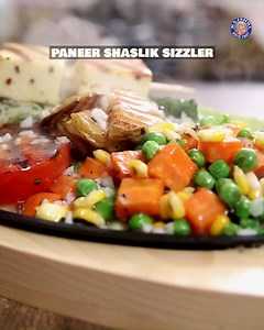 The Bombay Chef, Varun Inamdar, brings you the best sizzler recipe to recreate that amazing restaurant experience right at home. This Paneer Shashlik Sizzler is packed with perfectly marinated paneer, colourful veggies, a smoky sauce, and all the exciting elements that make a sizzler a true feast! Host: Varun Inamdar Ingredients For Paneer sticks 12-15 paneer cubes 1 tsp oil 1 tsp Italian herbs 1 tsp chilli flakes 1 tsp black pepper powder Salt to taste 2-4 skewers For parsley rice 1 cup boiled 