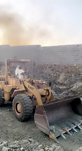 Large CAT Wheel Loader in Action at Construction Site