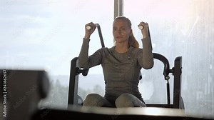 Woman of middle age working out in gym.