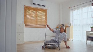 Asian senior elderly male fall on the ground while walk alone in house.