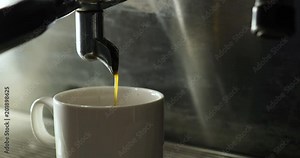 Making Fresh coffee. Barista makes coffee in coffee bar. Coffee machine making cappuccino espresso coffee Stock Video