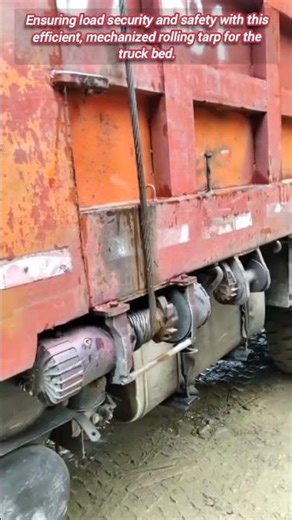 Automated rolling tarp system for dump truck load security.