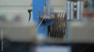 Production of copper cable. Rotating shafts with copper wire. Cable plant