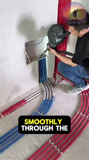 Electric fish tape pulls wires smoothly through long, curved conduits.#Electrician #WirePulling