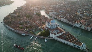 Venice city skyline, aerial view of Basilica di Santa Maria della Salute and Grand Canal, triangular shape architecture, Venetian Lagoon, Italy
