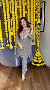 A beautiful monochrome chevron print coordinated set that defines modern elegance with a hint of festive sparkle. The tail-cut kurta features mirror lace detailing on the hemline and sleeves, while the neckline is heavily embellished with real mirror work, enhanced with podi and lace detailing—giving it a sophisticated yet chic appeal. The geometric chevron print adds a vibrant and contemporary vibe, making it a perfect outfit for the wedding season, from cocktail nights to sangeet celebrations,