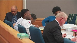 Twins charged with murder after body found in concrete