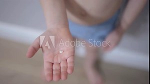 Boy shows fallen tooth on palm child development childhood growth and transition of baby teeth. Smiling boy displays lost tooth in hand step in child growth natural process of losing baby teeth