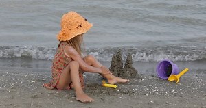 Blonde Little Girl Applying Sunscreen Lotion, Kid Playing with Cream on Beach by Sea, Caucasian Child with Sun Block on Coastline, Seashore