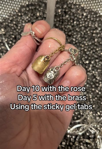 Digging through the stainless steel shot with my rose tattoo silver Nail Armor and the brass Nail Armor. The silver is on day 10 and the brass is day 5! Not pictured is the silver on my right middle also on day 5. #fyp #viral #nailart #customjewelry