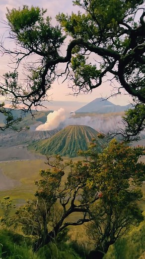 Floris Hermans on Instagram: "Indonesia #bucketlist Tip: Watching the sunrise at Mount Bromo 🌋 an active volcano in East Java, is such a magical experience. ✨ As the first rays of light pierce through the misty surroundings, the vibrant hues of the sky create a breathtaking spectacle. Standing proud at an elevation of 2,329 meters, Bromo Volcano is an active stratovolcano within the Bromo Tengger Semeru National Park. Its iconic cone-shaped peak rises majestically against the sky, surrounded by