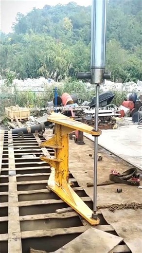 Straightening a Yellow Front Loader Arm with Hydraulics