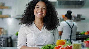 Curvy Latina teacher with curly hair leads a cooking class, teaching students traditional recipes in a school kitchen with modern appliances