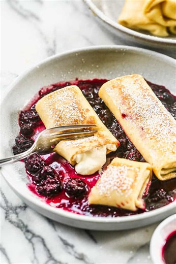 Shout 'BLINTZES' to grab the recipe! 💌 For those who can't decide between sweet and savory for breakfast, cheese blintzes are your dream come true. 🥞 | Tastes Better From Scratch
