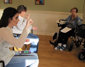 Student Teaches Sign Language to Joliet Nursing Home Residents