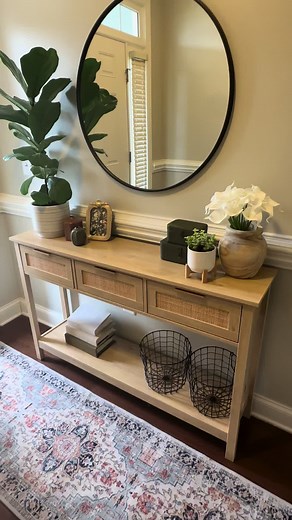 This is the best entryway table with boho natural vibes! Its been so fun to style through the seasons and is very functional for us. It prevents us from loosing our keys and wallets because we have the perfect place to put everything as soon as we walk through the door! #boho #rattan #table #entrywaydecor #homedecor #coolproducts #clean #freshlook #fallaesthetic