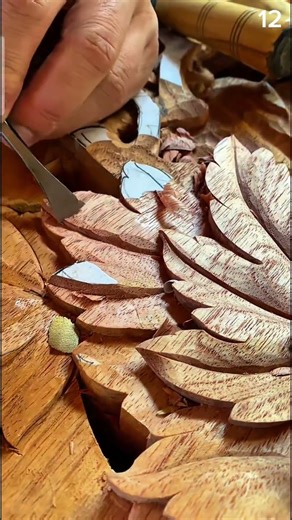 Wood carved with care—leaf motif guided by paper template