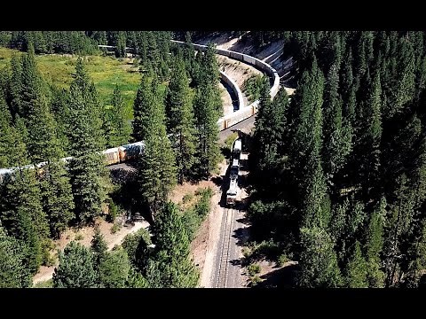 4K: Williams Loop Aerial View Perspective: Union Pacific Autorack train crosses underneath itself!