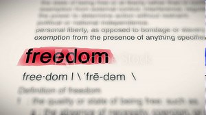 The Word Freedom Red Highlighted in a Dictionary Animation