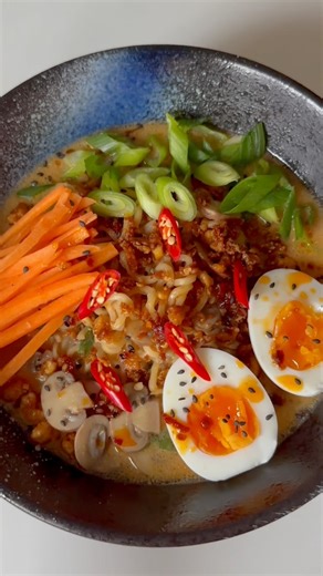 5 Minute Mushroom & Miso Ramen 🍄‍🟫🍜 Ingredients (2 servings): -2 squares ramen noodles -150g chestnut mushrooms, sliced -3 spring onions, chopped -2 garlic cloves, minced -2 tablespoons tahini -2 tablespoons miso paste -2 teaspoons gochujang paste -1 can coconut milk -600ml vegetable stock Toppings: boiled eggs, fresh carrots, shredded tofu, spring onions, chillies, chilli oil. Instructions: 1. Add all the ingredients to a pot, cover and simmer for 5 minutes. Taste the soup and season with so