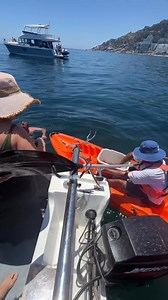 Buying ice cream off a boat in Clifton 4th beach | Jean-michel Victor