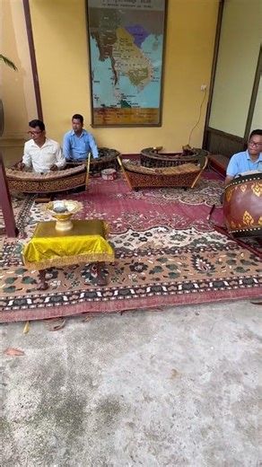 The boys play traditional Khmer xylophones