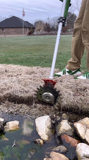 Cutting Grass with Rotary Scissors for Lawn Care