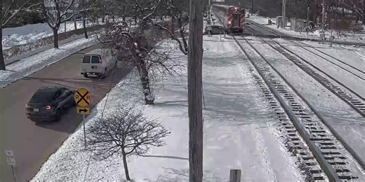 Commuter train crashes into car sitting near tracks