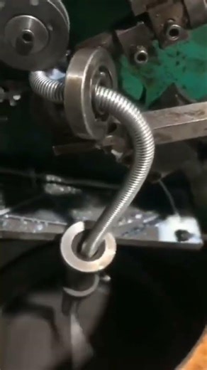 Semi-automatic shower hose machine.