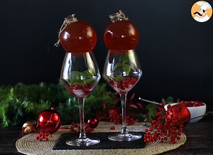 Pomegranate spritz recipe: cocktail in a christmas bauble