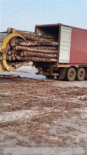 Loader unloads log containers in rows