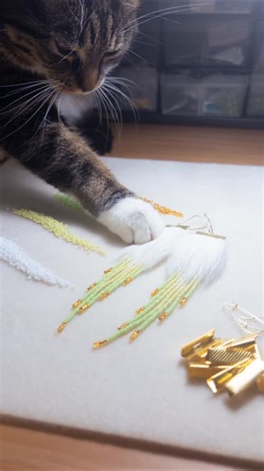 This Claw on Instagram: "baddie incoming, Claw calls first dibs hehe 💅🏽✨ GROWTH (Available!) 5.75” Stainless Steel Hooks, Stainless Steel Ribbon Claw Connector, Bugle Beads, Czech Seed Beads, Rabbit Fur. Sewing Thread. Valued at $120. #indigenousart #nailsnailsnails #beadedearrings #cats_of_instagram #beadwork"