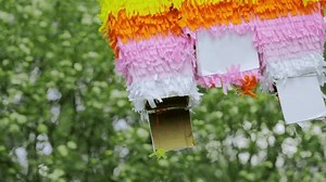 Close-up Broken Torn Pinata Hangs Against Stock Footage Video (100% Royalty-free) 1104378655 | Shutterstock
