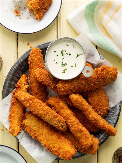 FRICKLES (FRIED PICKLES) Okay dill pickle lovers--this fried pickles spears recipe is for you. You may have had deep-fried pickle chips before, but these kick things up a notch. Thick dill pickle spears get double-dredged for maximum crunch, are fried until perfectly golden, and are served with homemade ranch that has a little boost from that dill pickle brine. Trust me: these are about to become your latest obsession. Head to littleblackskillet.com to get this crispy fried pickles recipe and be