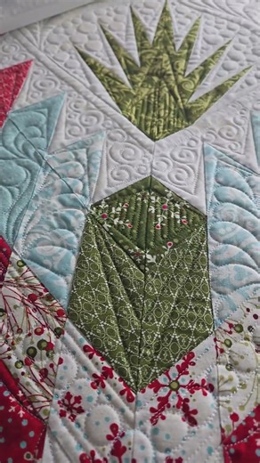 Beautiful Fabrics and Quilting on a Quiltworx Quilt